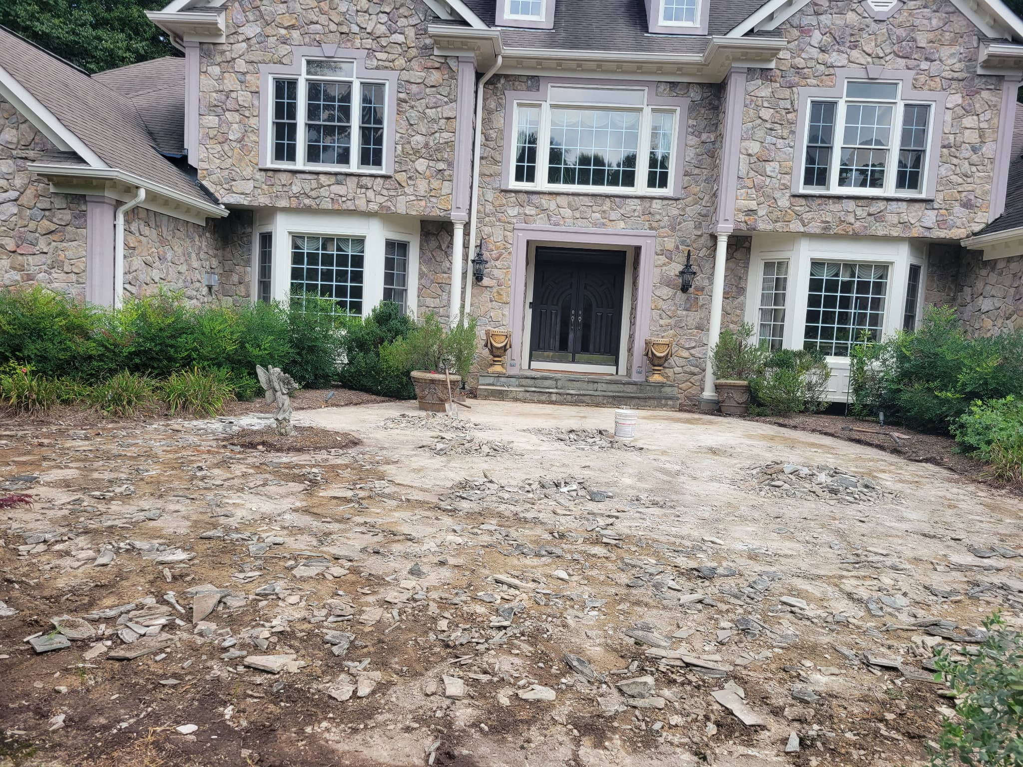 Old cracked flagstone driveway and entry courtyard before removal, McLean